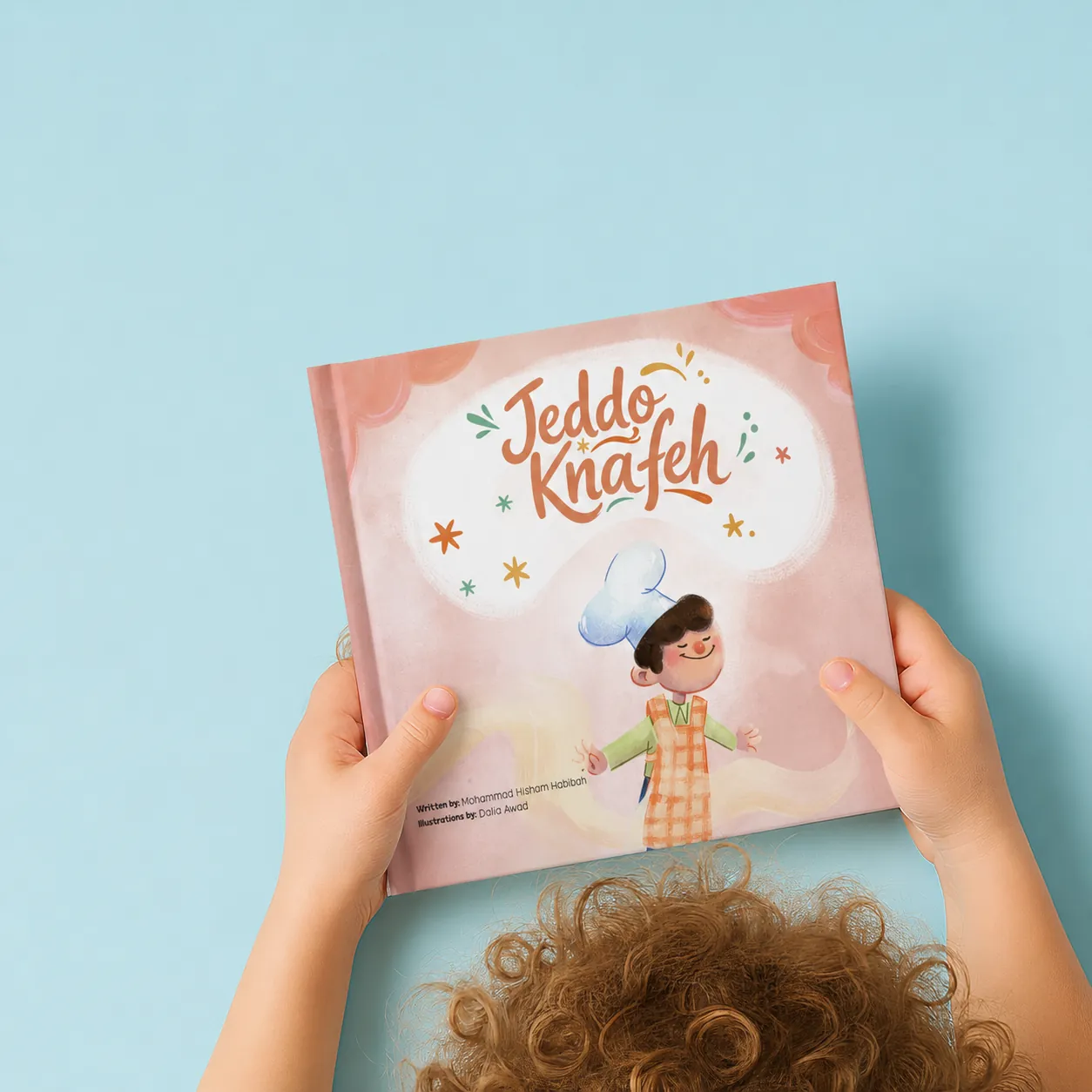 Small hands holding the book