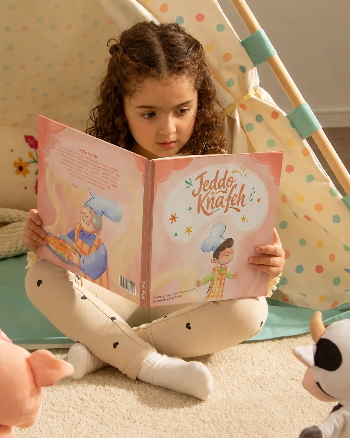 A child reading the Jeddo Knafeh book